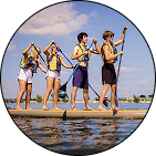 Group of friends paddle boarding