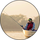 Guy fishing in boat
